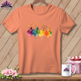 Peach t-shirt with watercolor sewing notions and rainbow patchwork quilt squares.