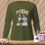Green long-sleeve shirt with a Frankenstein-stitch sewing machine graphic that says 