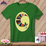 Green t-shirt with a crescent moon made of colorful fabric scraps featuring a witch.