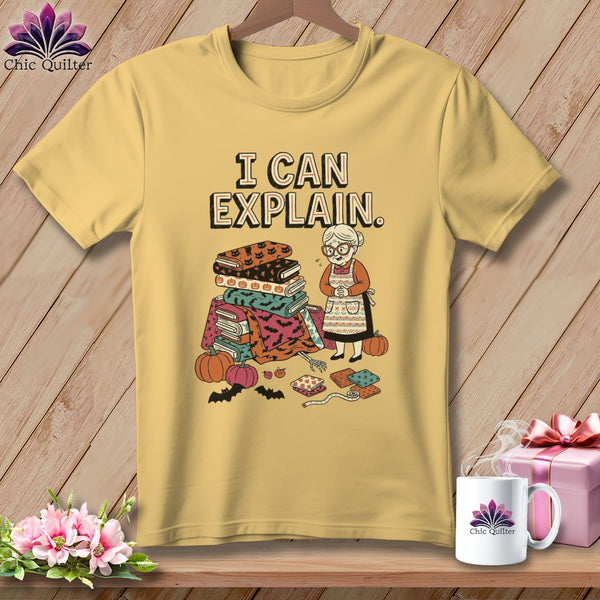 Yellow t-shirt with "I CAN EXPLAIN" and a quilter with Halloween-themed fabrics.