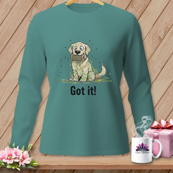 Teal long-sleeve shirt with a cartoon golden retriever tangled in colorful string, saying "Got it!".