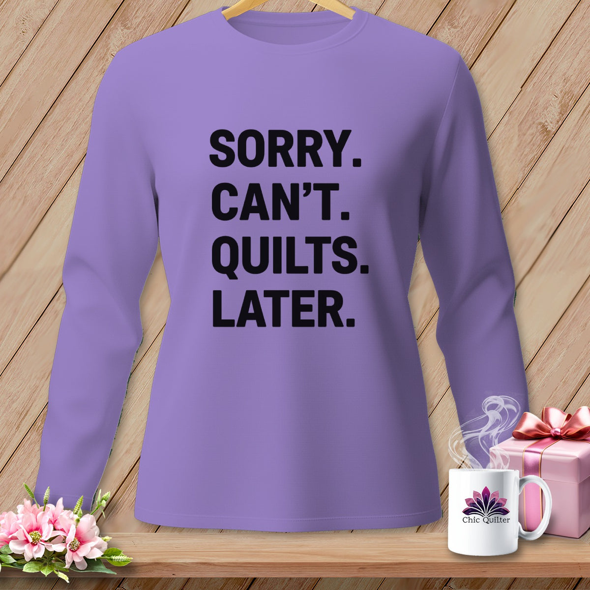 Purple long-sleeved shirt with black text "SORRY. CAN'T. QUILTS. LATER."