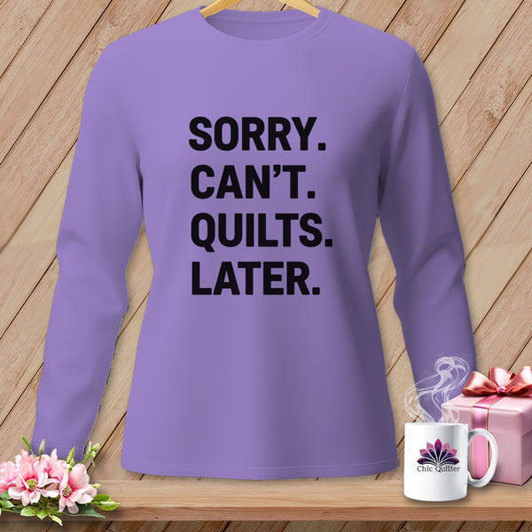 Purple long-sleeved shirt with black text "SORRY. CAN'T. QUILTS. LATER."