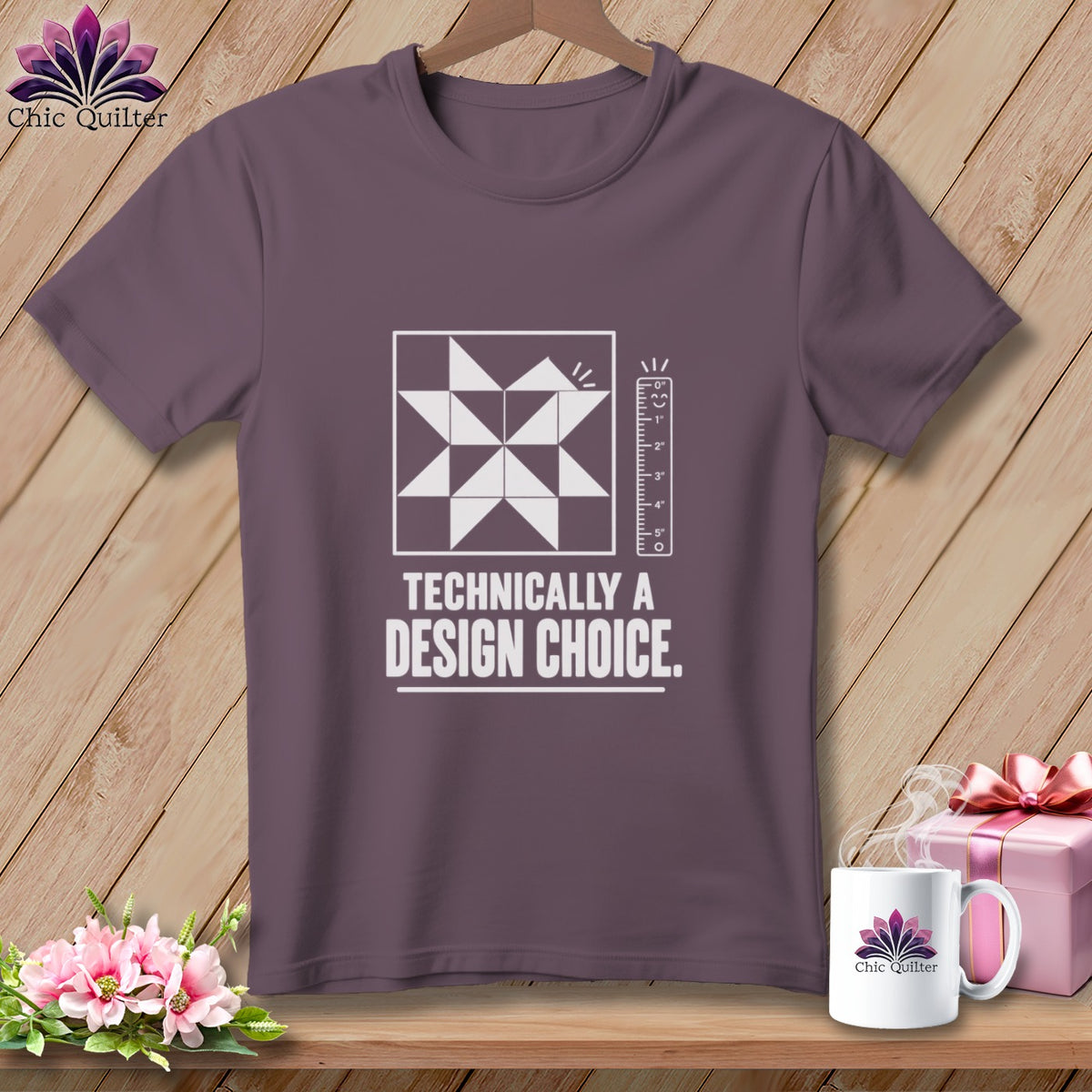 T-shirt with quilt block, ruler graphic, and text "Technically a Design Choice."