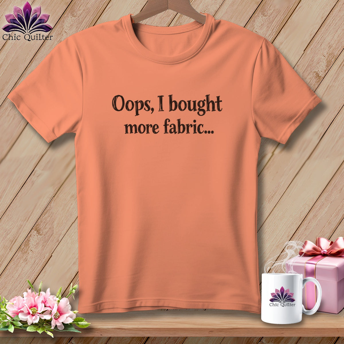 Peach t-shirt with "Oops, I bought more fabric..." text and Chic Quilter logo.