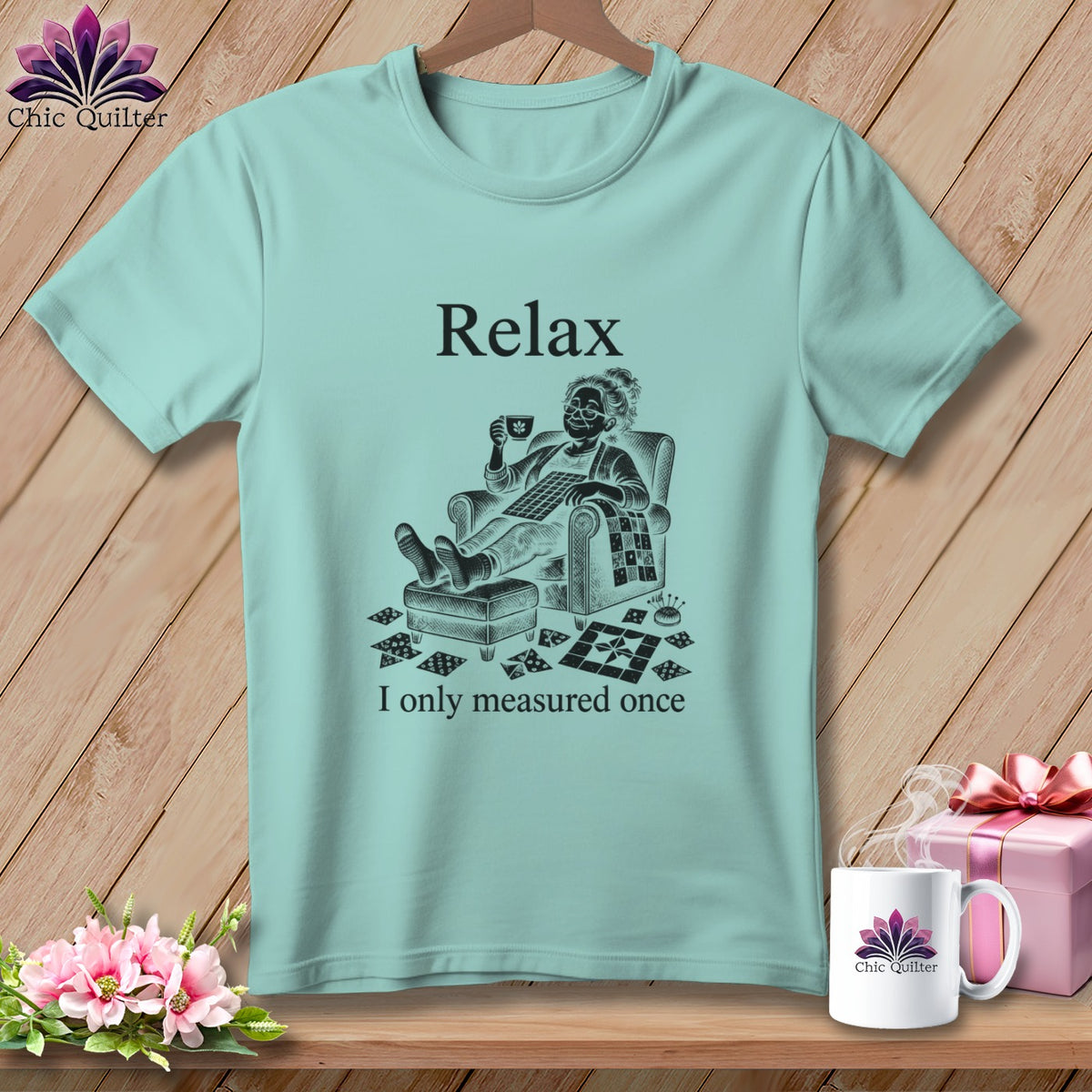 Light blue t-shirt with "Relax, I only measured once" and a quilter graphic.