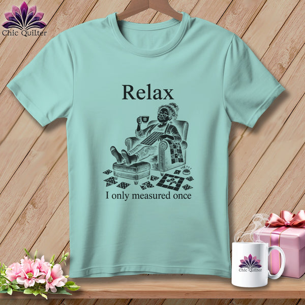 Light blue t-shirt with "Relax, I only measured once" and a quilter graphic.