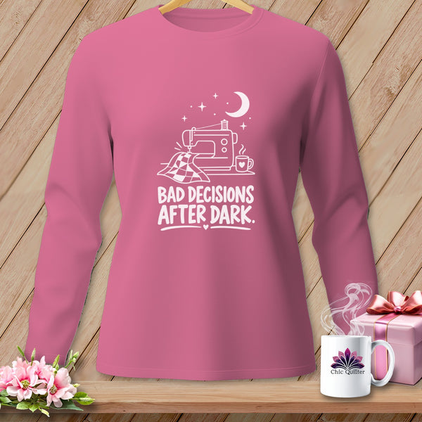 Pink long sleeve shirt with sewing machine graphic and text "Bad Decisions After Dark."
