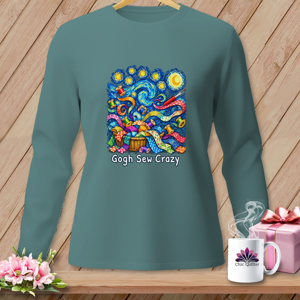 Long sleeve shirt with "Gogh Sew Crazy" print featuring colorful fabric scraps and spools of thread.