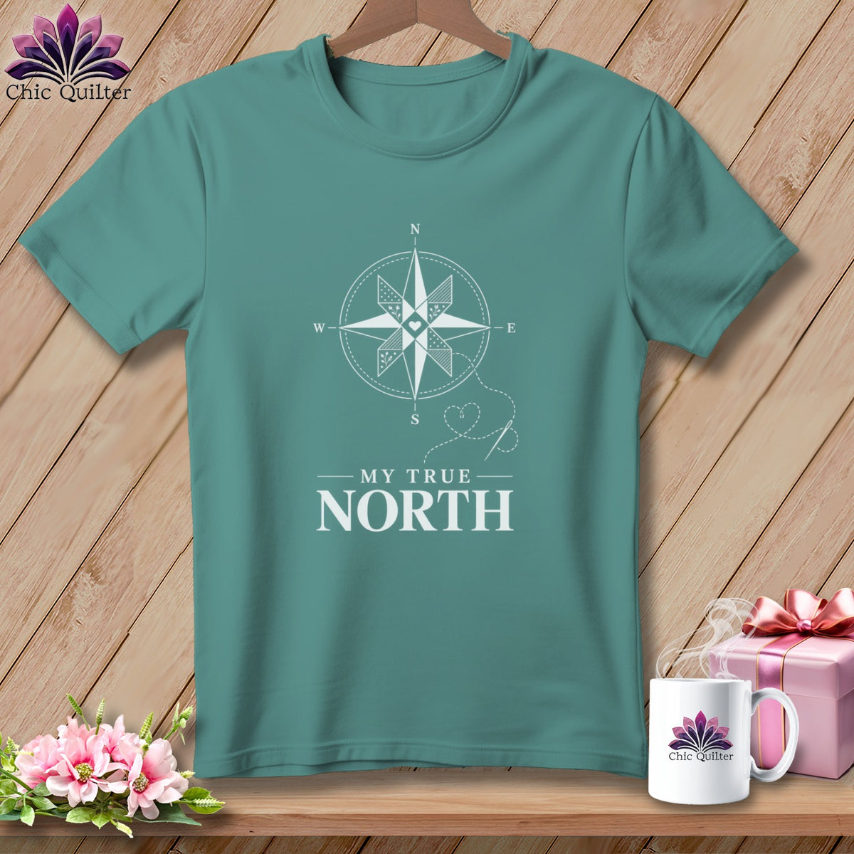 Teal t-shirt with white compass graphic and text "MY TRUE NORTH".