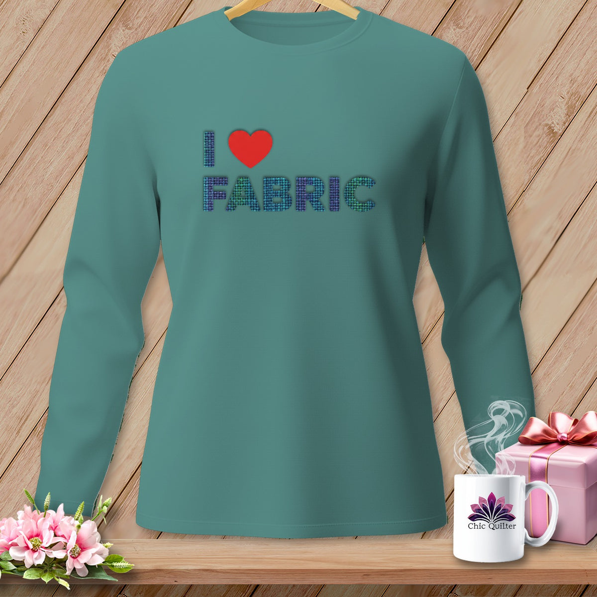 Teal long-sleeve shirt with "I ❤️ FABRIC" graphic, mug, and gift.