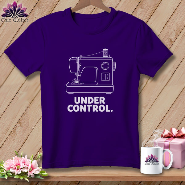 Purple t-shirt with white sewing machine graphic and text "UNDER CONTROL."