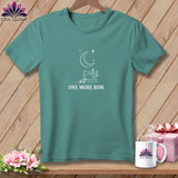 Teal t-shirt with white graphic of sewing machine, moon, stars, and text 