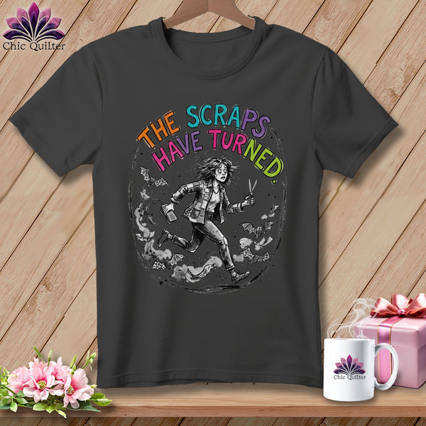 Dark grey t-shirt featuring a circular graphic with text "THE SCRAPS HAVE TURNED" and a running figure.