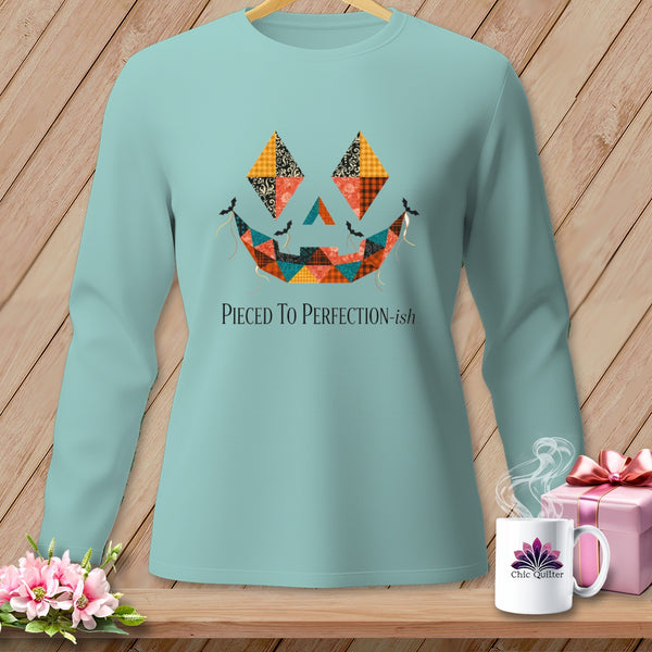 Light blue long-sleeve shirt with quilted jack-o'-lantern face and "Pieced To Perfection-ish" text.
