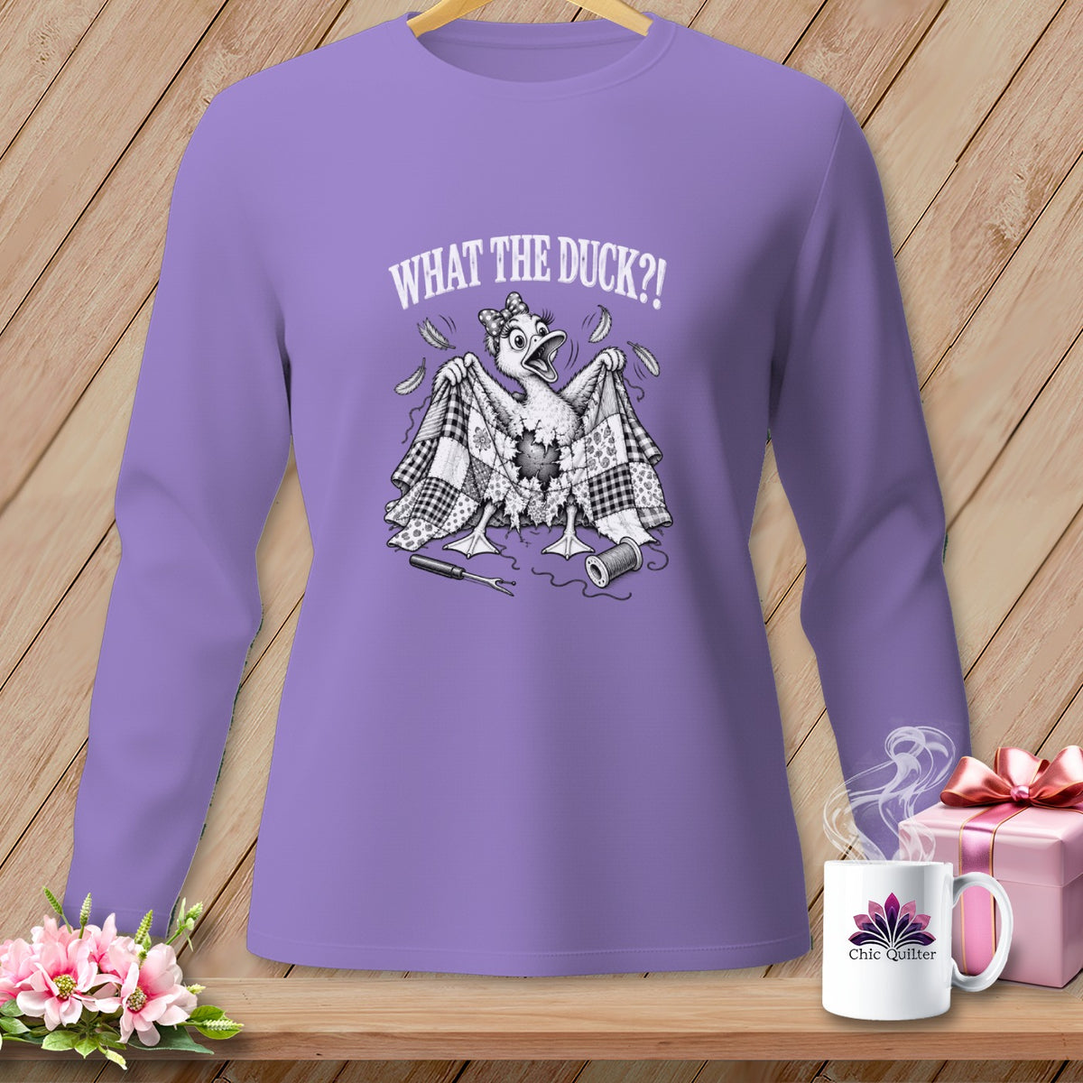 Purple long-sleeved shirt with a humorous black-and-white duck graphic and the text WHAT THE DUCK?!