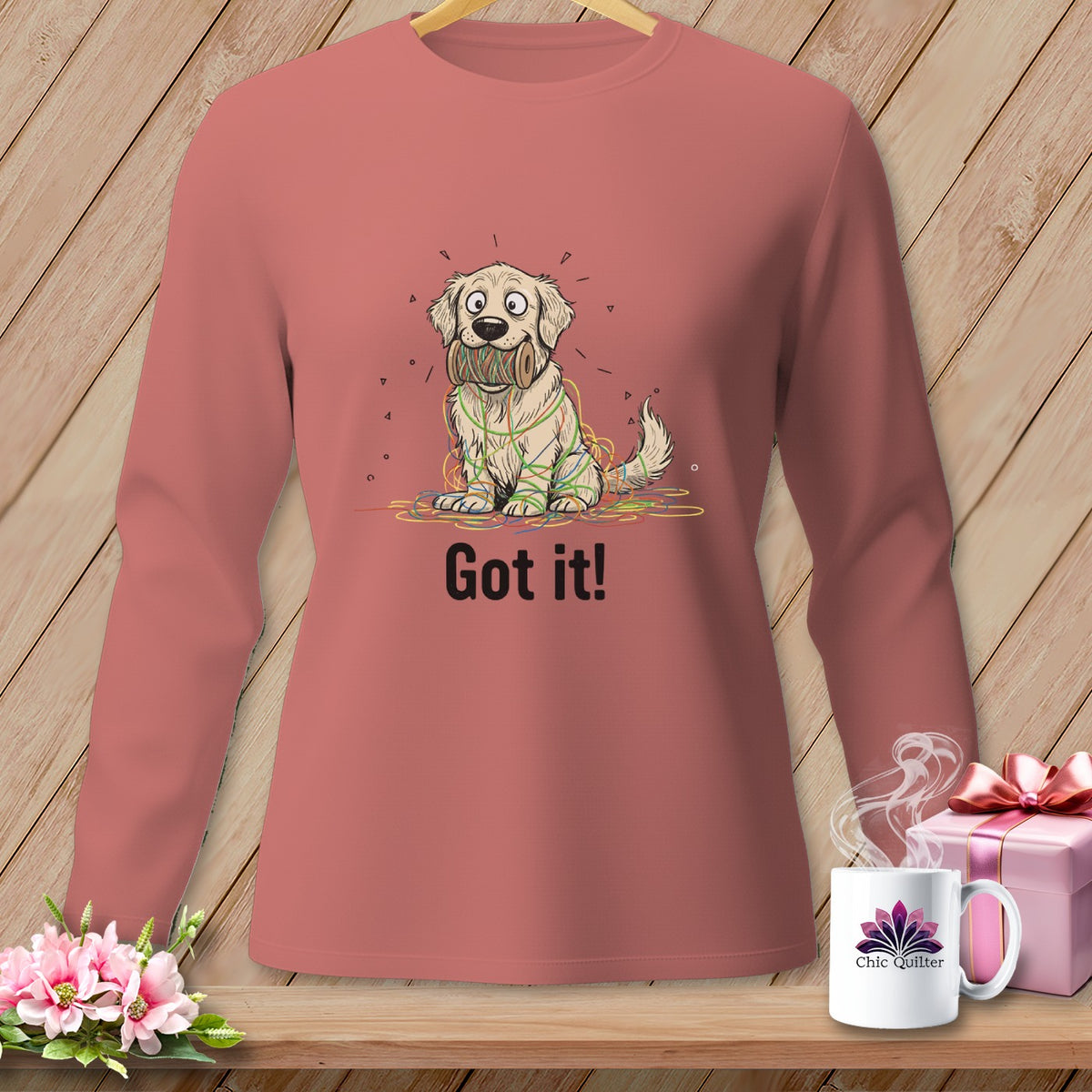 Golden retriever tangled in colorful yarn with "Got it!" text.