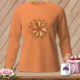 Orange long-sleeve shirt with a dresden plate design of sewing notions.