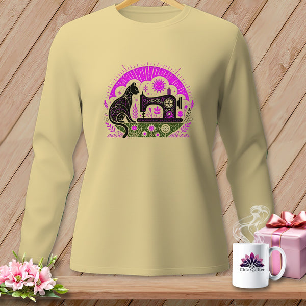 Cream long-sleeve shirt with a black and purple sewing machine and cat graphic.
