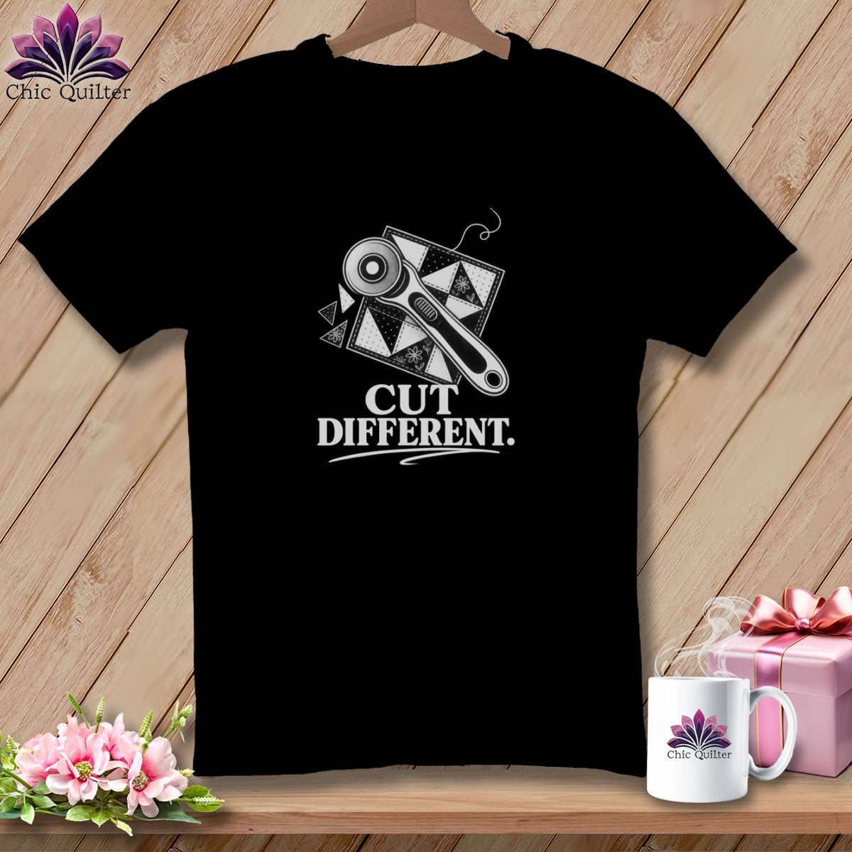 Black t-shirt with "CUT DIFFERENT." and rotary cutter over quilt blocks.