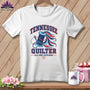 A white t-shirt featuring a blue spool of thread, a needle, and the text Tennessee Quilter.