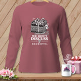 Long sleeve shirt with stack of fabrics, scissors, and text 