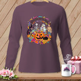 Quilters After Dark Halloween graphic on purple long-sleeve shirt with pumpkin, skeleton, mummy, and witch.