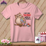 Pink t-shirt with a tired owl covered in quilt pieces and the text 