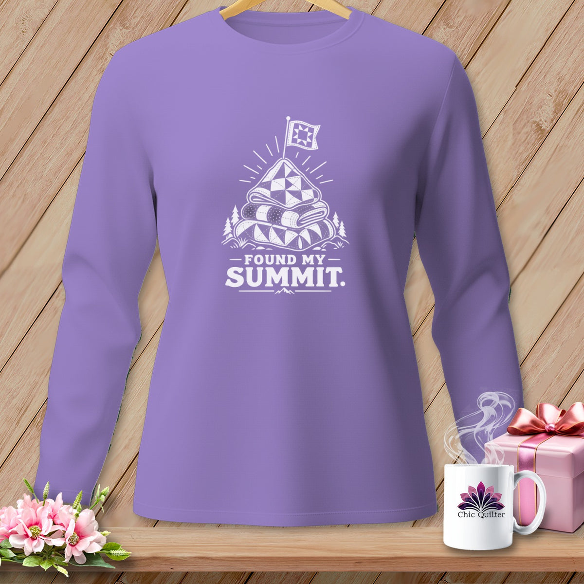 Lavender long-sleeve shirt with a quilt-themed "Found My Summit" graphic.