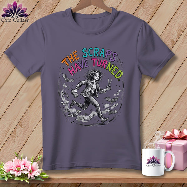 T-shirt with "The Scraps Have Turned" text and a running figure with scissors.
