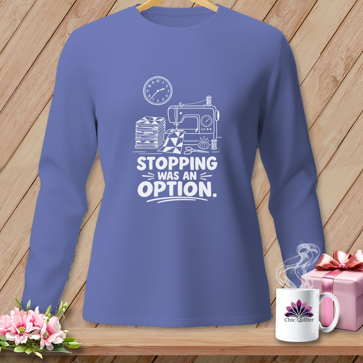 Long sleeve shirt with sewing graphic and text "Stopping Was An Option."