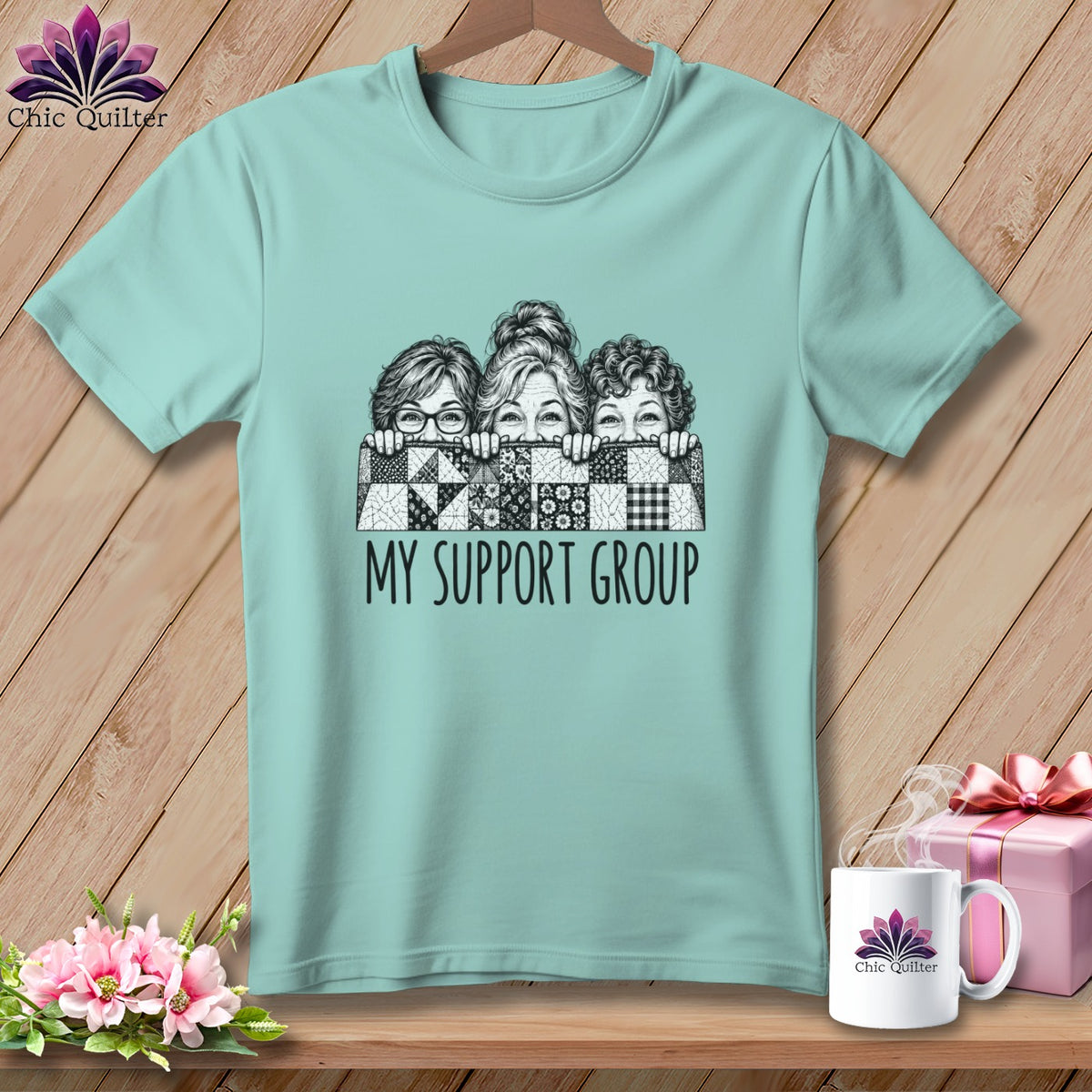 Teal t-shirt with three women peeking over a quilt, reading "MY SUPPORT GROUP".