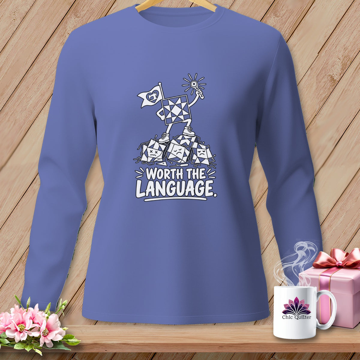 Long sleeve shirt with a cartoon quilt piece standing on others, text "Worth the Language".