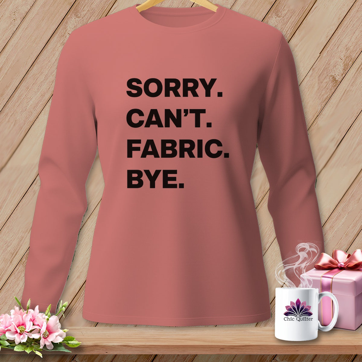 Rose long-sleeve shirt with black text: "Sorry. Can't. Fabric. Bye."