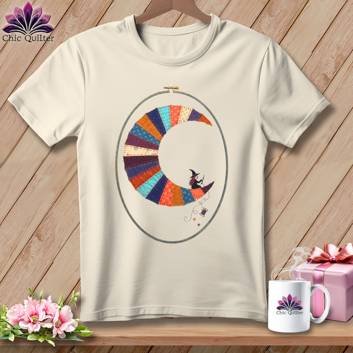 Cream t-shirt with a crescent moon made of colorful fabric patches and a witch riding it.