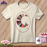 Cream t-shirt with a crescent moon made of colorful fabric patches and a witch riding it.