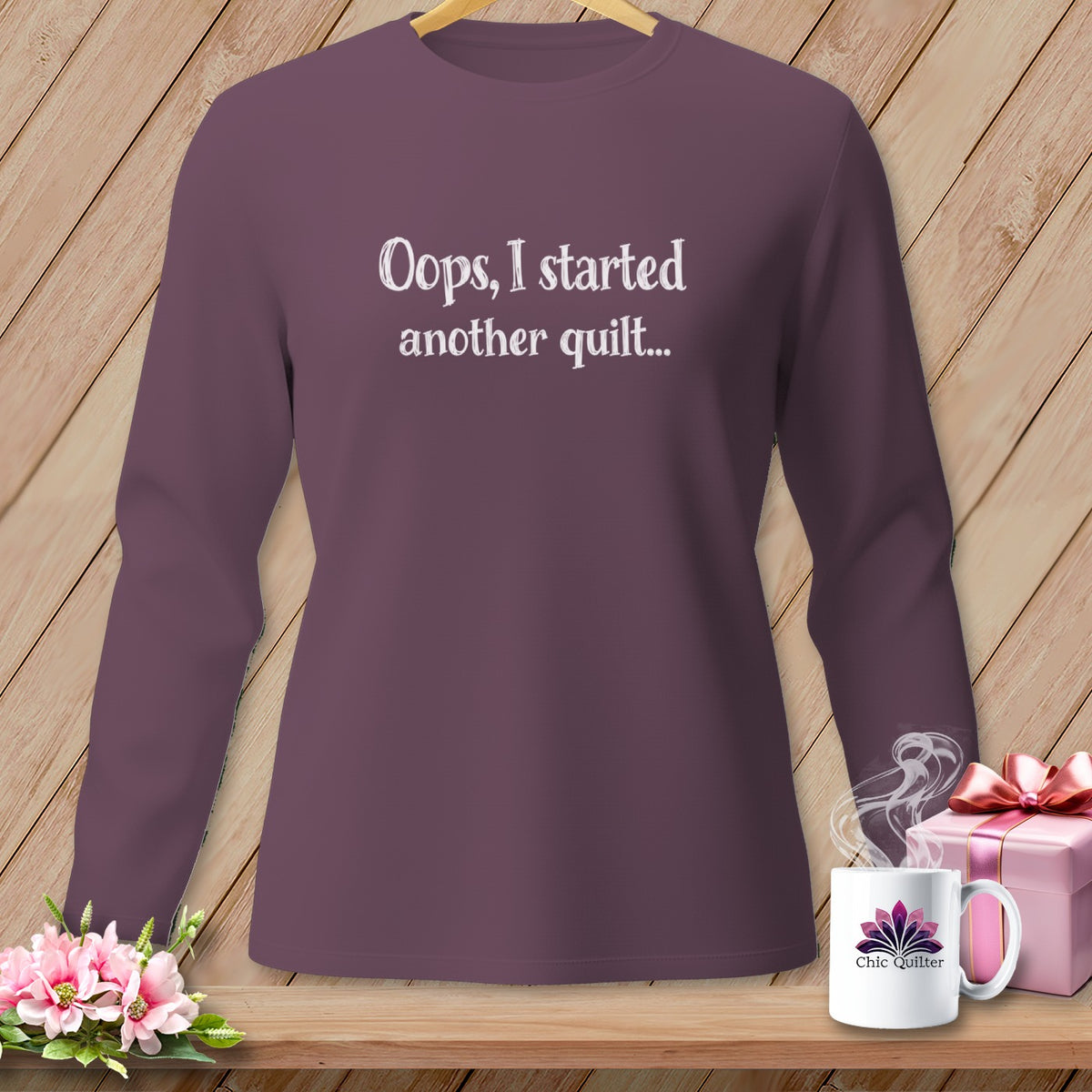 Purple long-sleeve shirt with "Oops, I started another quilt..." text.