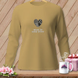 Tan long-sleeve shirt with patched heart graphic and text 