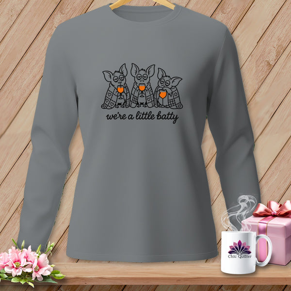 Long-sleeve shirt with three bats drinking from glasses and text "we're a little batty".