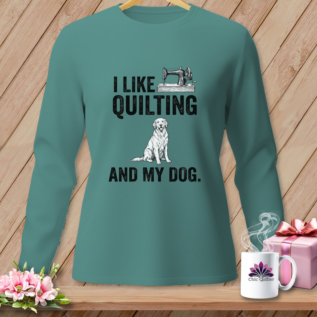 Teal long-sleeve shirt with "I like quilting and my dog" graphic.
