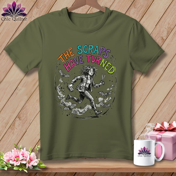 Olive green t-shirt with distressed circular graphic and text "The Scraps Have Turned".