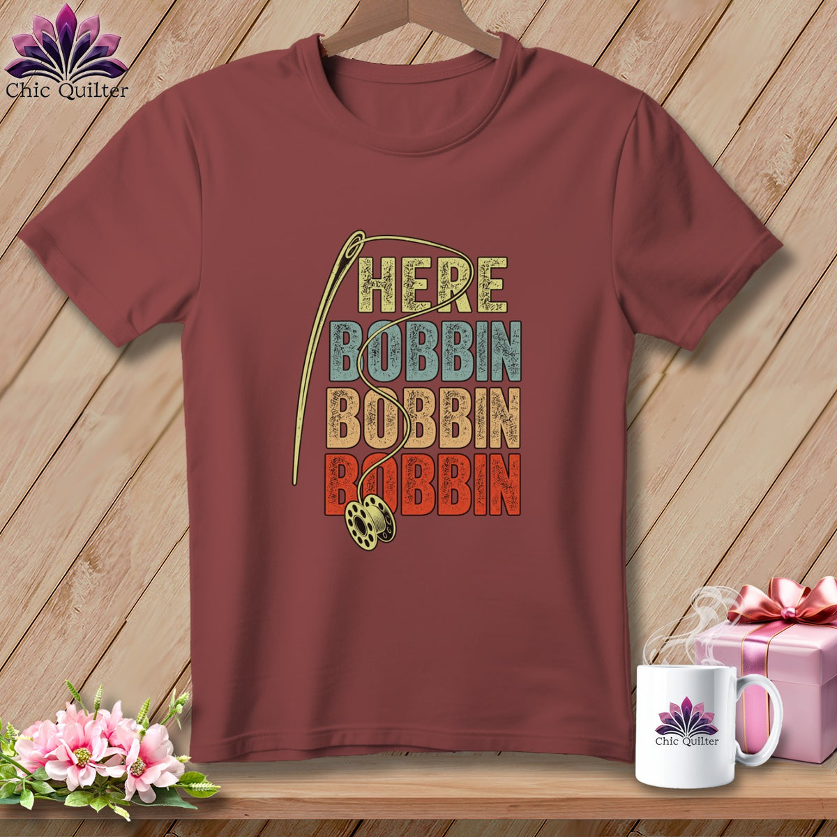Maroon t-shirt with needle, bobbin, and "HERE BOBBIN BOBBIN BOBBIN" text.