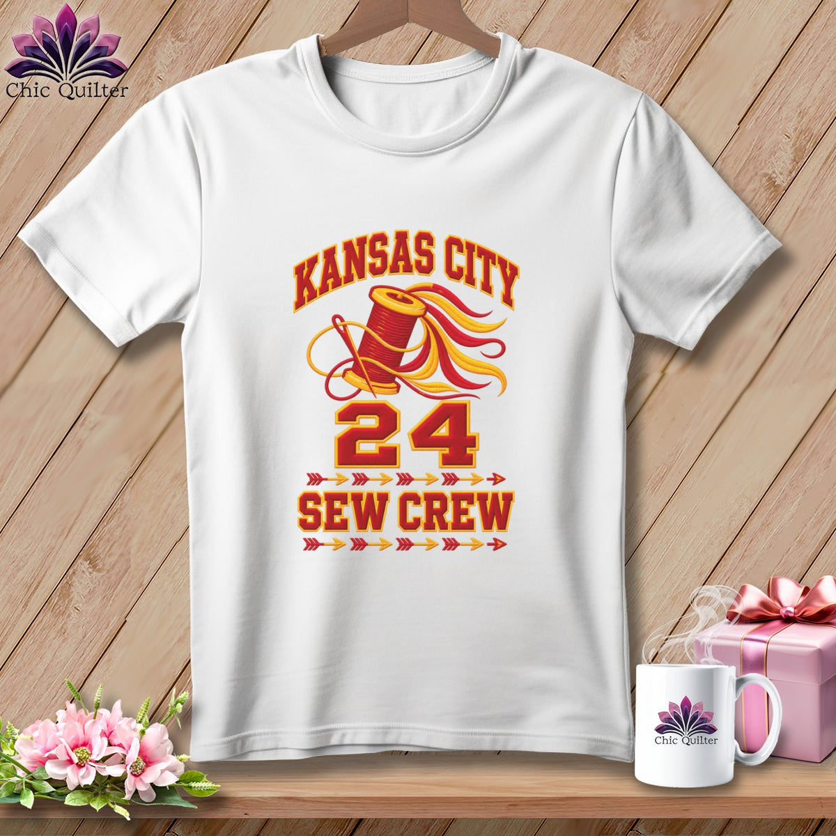 White crewneck t-shirt featuring a red and yellow graphic with text that reads Kansas City Sew Crew and the number 24.