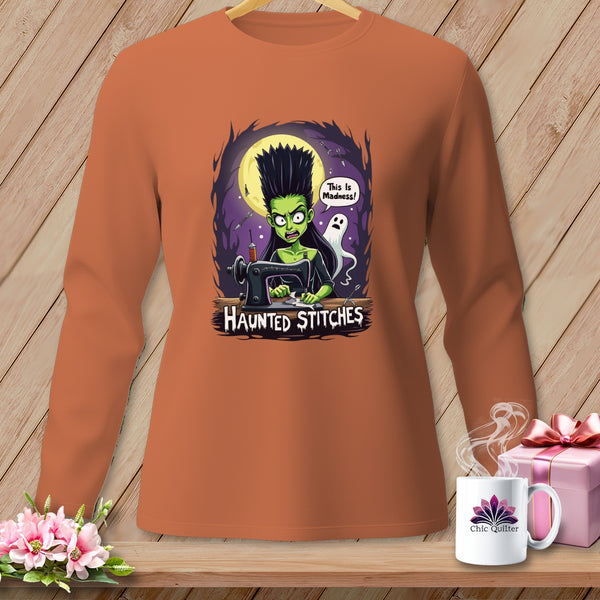 Haunted Stitches long-sleeve shirt featuring a cartoon Frankenstein woman sewing with a ghost.