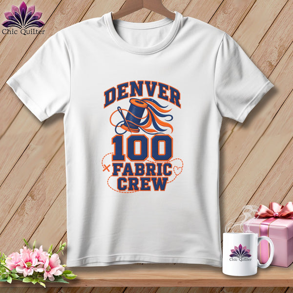 White t-shirt featuring a blue and orange graphic with text reading Denver 100 Fabric Crew.