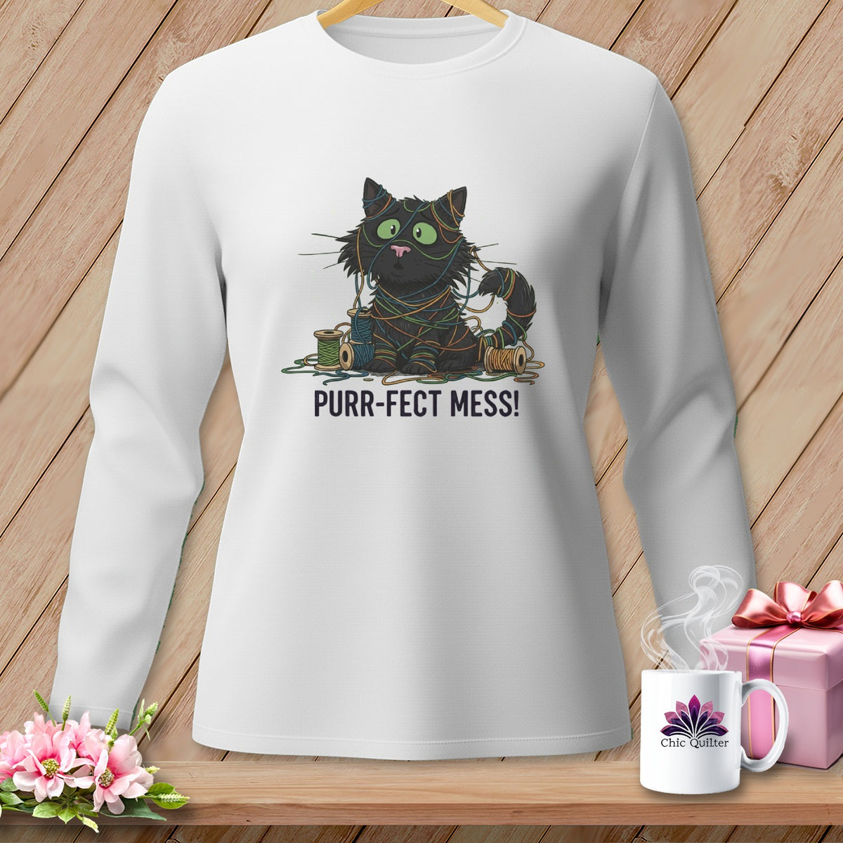 White sweatshirt with a graphic of a tangled black cat and "Purr-fect Mess!" text.