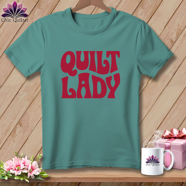 Teal t-shirt with red text that reads "QUILT LADY".
