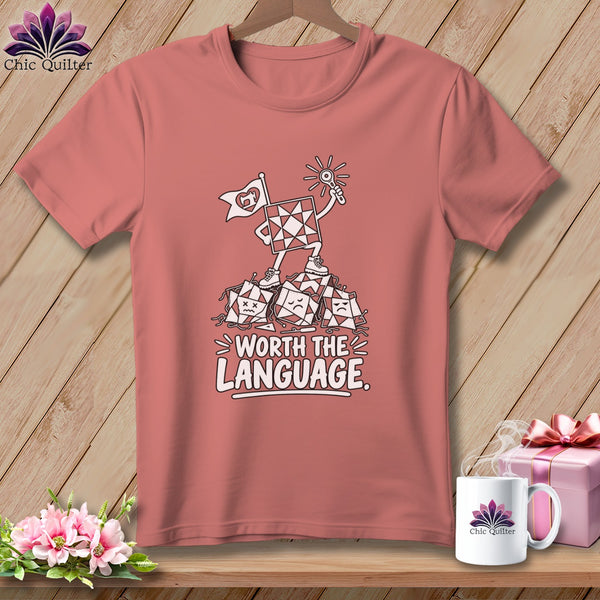 Pink t-shirt with cartoon quilt squares celebrating "Worth the Language."