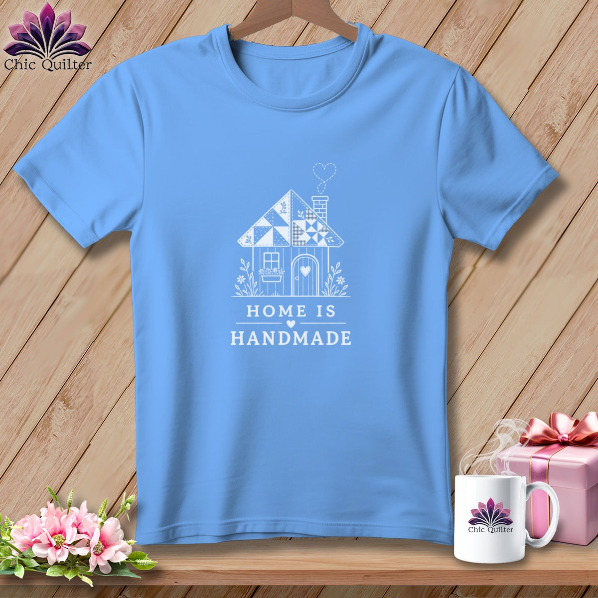 Light blue t-shirt with white house graphic and "HOME IS HANDMADE" text.