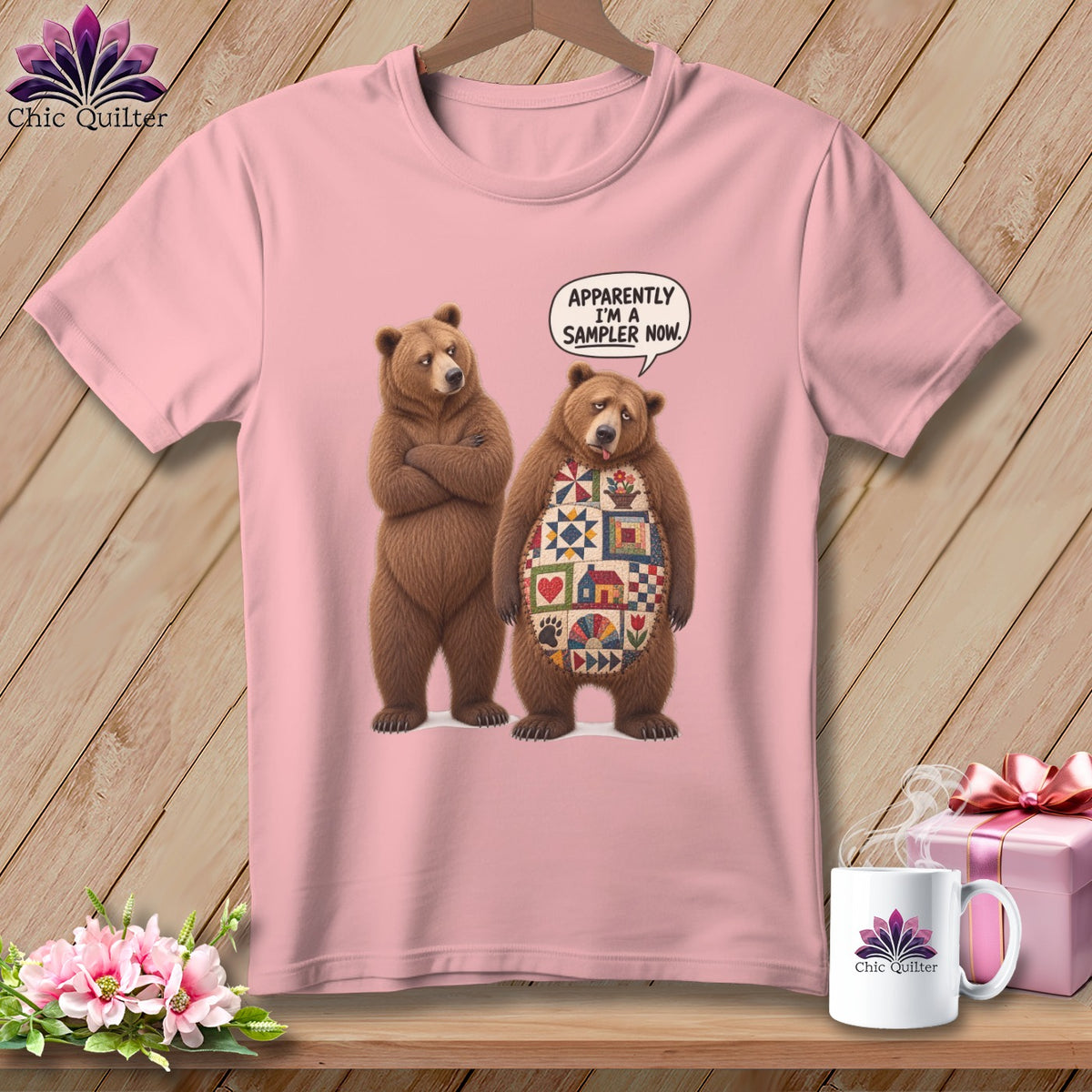 Pink t-shirt with two bears, one with a quilt pattern on its chest.